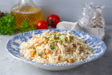 Traditional delicious Turkish food; Rice with chickpeas and chicken (Turkish name; Tavuklu nohutlu pilav or pilaf)