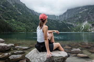 Young tourist girl on lake Morskie oko. Zakopane. Poland. Tatra National Park © Alex ST