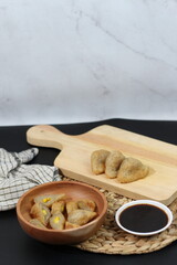 Delicious Pempek, Indonesian Snack with Sweet and Savory Sauce