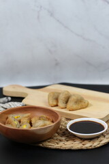 Delicious Pempek with Sweet and Savory Sauce