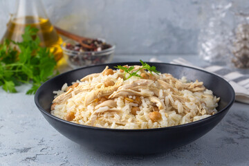 Traditional delicious Turkish food; Rice with chickpeas and chicken (Turkish name; Tavuklu nohutlu pilav or pilaf)