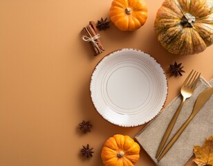 Thanksgiving dinner table setting with pumpkins, wheat, fallen leaf and black cutlery. Vertical composition, selective focus