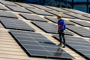 Solar engineer man working with solar panels on rooftop