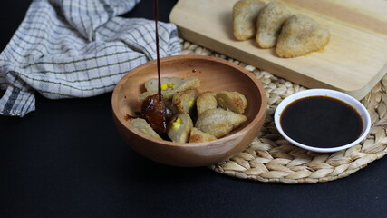 Delicious Pempek Dish with Brown Sauce
