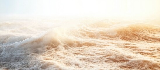 Dynamic ocean waves rolling onto a serene sandy beach with ample space for overlaying text or graphic elements