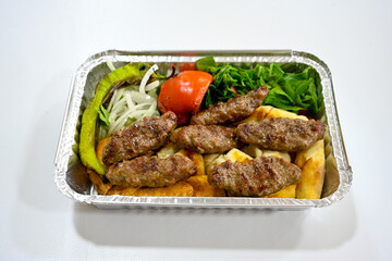 Meatball between bread (Turkish name : ekmek arasi kofte ) Izgara kofte. Manisa, Akcaabat, Akhisar  kofte. Delicious meat grilled meatballs.