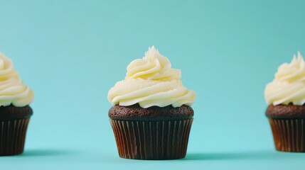 Decadent chocolate cupcakes with creamy buttercream frosting on a vibrant blue background showcasing delightful homemade dessert artistry