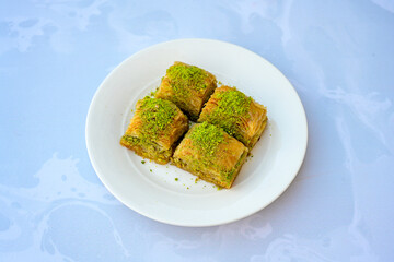 Turkish Dessert Sobiyet, havuc dilimi, midye baklava, mussels baklava and classic baklava with Pistachio . Cikolatali cevizli, fistikli soguk Baklava, top view.