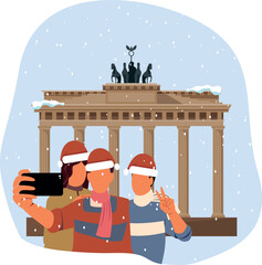 Friends take selfies near theBrandenburg Gate   on Christmas. © Svutlana