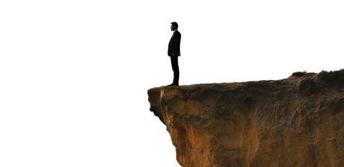 Businessman standing on the edge of a cliff, isolated on transparent cutout background