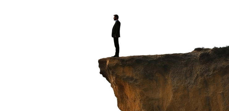 Businessman standing on the edge of a cliff, isolated on transparent cutout background