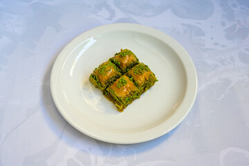 Turkish Dessert Sobiyet, havuc dilimi, midye baklava, mussels baklava and classic baklava with Pistachio . Cikolatali cevizli, fistikli soguk Baklava, top view.