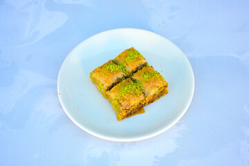 Turkish Dessert Sobiyet, havuc dilimi, midye baklava, mussels baklava and classic baklava with Pistachio . Cikolatali cevizli, fistikli soguk Baklava, top view.