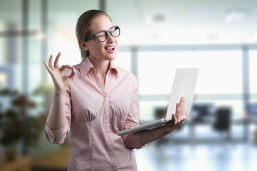 Portrait of young professional business woman in office.