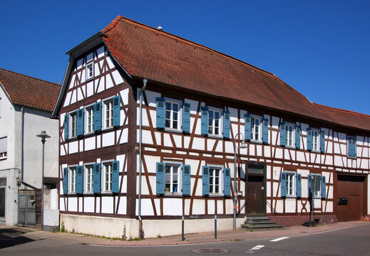A half-timbered wooden residential house with half hip roof in the old town of Kandel, Rheinland-Pfalz in Germany
