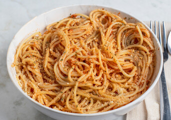 spaghetti top with parsley and parmesan cheese,