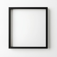 Minimalist's Delight: A sleek black picture frame hangs gracefully, offering a stark contrast against the neutral backdrop, symbolizing space and design.