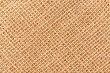 Burlap texture. A piece of torn burlap on a white background. Canvas. Packing material