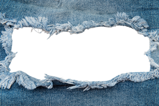 Hole in denim on a white background. Ripped jeans