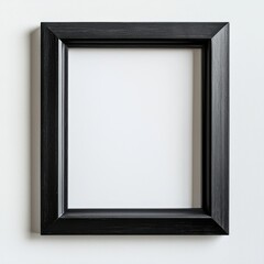 Fototapeta premium Black Frame Mockup: A minimalist black picture frame stands out against a simple backdrop, showcasing a versatile and elegant design.