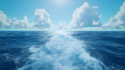 Fototapeta premium Wake of a ship on a sunny ocean with blue sky and fluffy clouds.