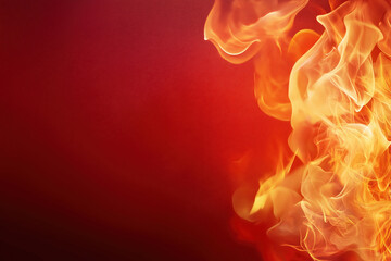 Vibrant flames dancing against a rich red background in a dramatic display of fire