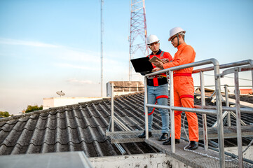 A solar panel maintenance and installer is checking the operation of an electrical circuit on a...