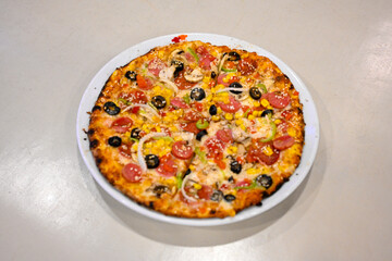 Traditional Turkish cuisine. Pizza, pita, pidesi, sucuk, hummus, kebab. Many dishes on the table. Serving dishes in restaurant. Margherita,  mix, formaggi, veggie karisik pizza. Top view, flat lay