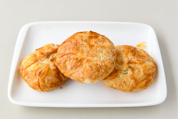 Turkish pastry product , tasty pogaca. Simit, gevrek. Turkish Pastries; peynirli, patatesli, kasarli pogaca, borek, acma, ay coregi at patisserie showcase. Boyoz peynirli acar. 