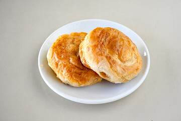 Turkish pastry product , tasty pogaca. Simit, gevrek. Turkish Pastries; peynirli, patatesli, kasarli pogaca, borek, acma, ay coregi at patisserie showcase. Boyoz peynirli acar. 