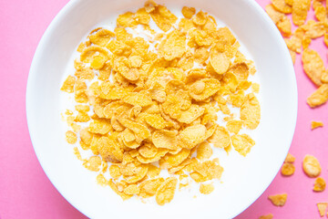 Top View of Cereal with Milk on Pink Background - Flat Lay of a Sweet Breakfast Delight