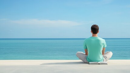 Fototapeta premium Person Meditating by the Ocean with a Book on a Tranquil Beach Day