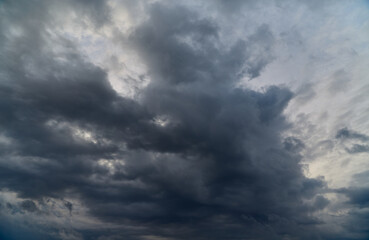 Gloomy clouds covering the sky symbolize winter overcast and chill.