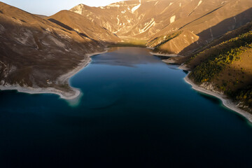 Obraz premium Beautiful aerial view of a mountain lake in a picturesque gorge. Landscape and nature of the North Caucasus