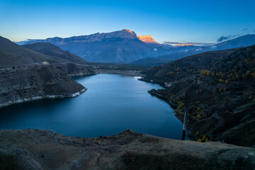 Fototapeta premium Beautiful aerial view of a mountain lake in a picturesque gorge. Landscape and nature of the North Caucasus