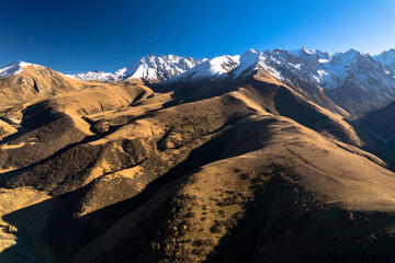 Aerial panorama overlooking mountain peaks. Landscape and nature of the North Caucasus