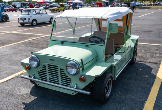 Chicago, Illinois, USA - September 08, 2024: Mini Moke retro military convertible car vehicle, corner view. Retro car. Retro Mini Moke car. Mini Moke mint color at Chicago
