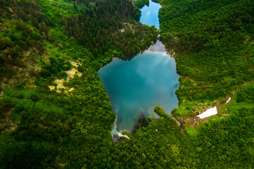 Mountain lake with blue water in a picturesque gorge. Landscape and nature of the North Caucasus