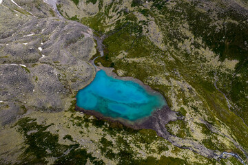 Mountain lake with blue water in a picturesque gorge. Landscape and nature of the North Caucasus