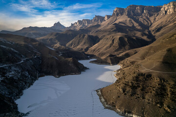 Mountain lake with blue water in a picturesque gorge. Landscape and nature of the North Caucasus