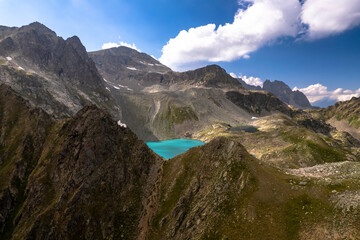 Mountain lake with blue water in a picturesque gorge. Landscape and nature of the North Caucasus