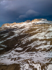 Beautiful aerial view of snowy peaks in a picturesque gorge. Landscape and nature of the North Caucasus