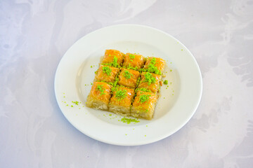 Turkish Dessert Sobiyet, havuc dilimi, midye baklava, mussels baklava and classic baklava with Pistachio . Cikolatali cevizli, fistikli soguk Baklava, top view.