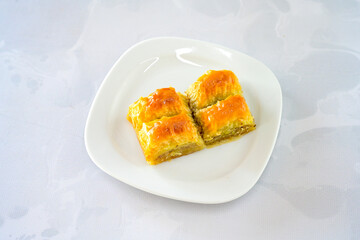 Turkish Dessert Sobiyet, havuc dilimi, midye baklava, mussels baklava and classic baklava with Pistachio . Cikolatali cevizli, fistikli soguk Baklava, top view.
