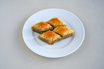 Turkish Dessert Sobiyet, havuc dilimi, midye baklava, mussels baklava and classic baklava with Pistachio . Cikolatali cevizli, fistikli soguk Baklava, top view.