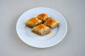 Turkish Dessert Sobiyet, havuc dilimi, midye baklava, mussels baklava and classic baklava with Pistachio . Cikolatali cevizli, fistikli soguk Baklava, top view.