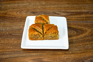 Turkish Dessert Sobiyet, havuc dilimi, midye baklava, mussels baklava and classic baklava with Pistachio . Cikolatali cevizli, fistikli soguk Baklava, top view.