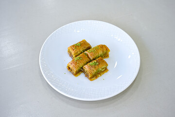 Turkish Dessert Sobiyet, havuc dilimi, midye baklava, mussels baklava and classic baklava with Pistachio . Cikolatali cevizli, fistikli soguk Baklava, top view.