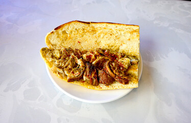 Lavash zurna doner kebab ( zurna  durum )  or shawarma sliced in plate isolated.  hatay usulu tavuk Et doner durum. Gobit ekmek arasi doner. Pilavustu iskender doner kebap. 