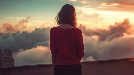 Fototapeta premium Solitude Above the Clouds: A Woman Contemplates the Sunset